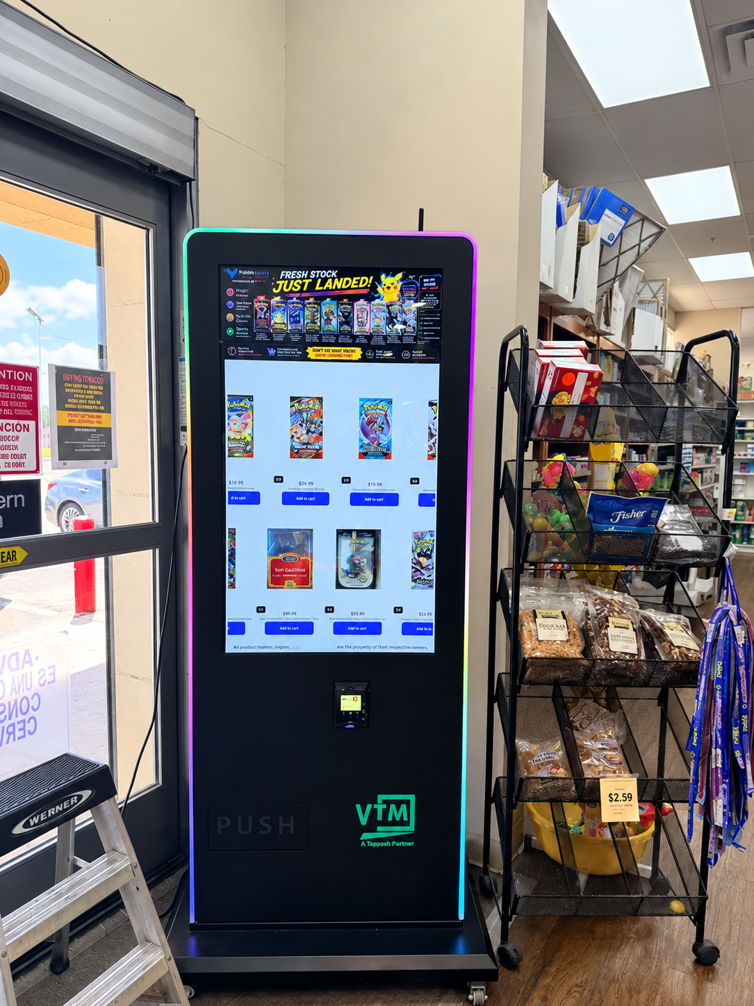 Full-size touchscreen Pokémon card vending machine in a retail store